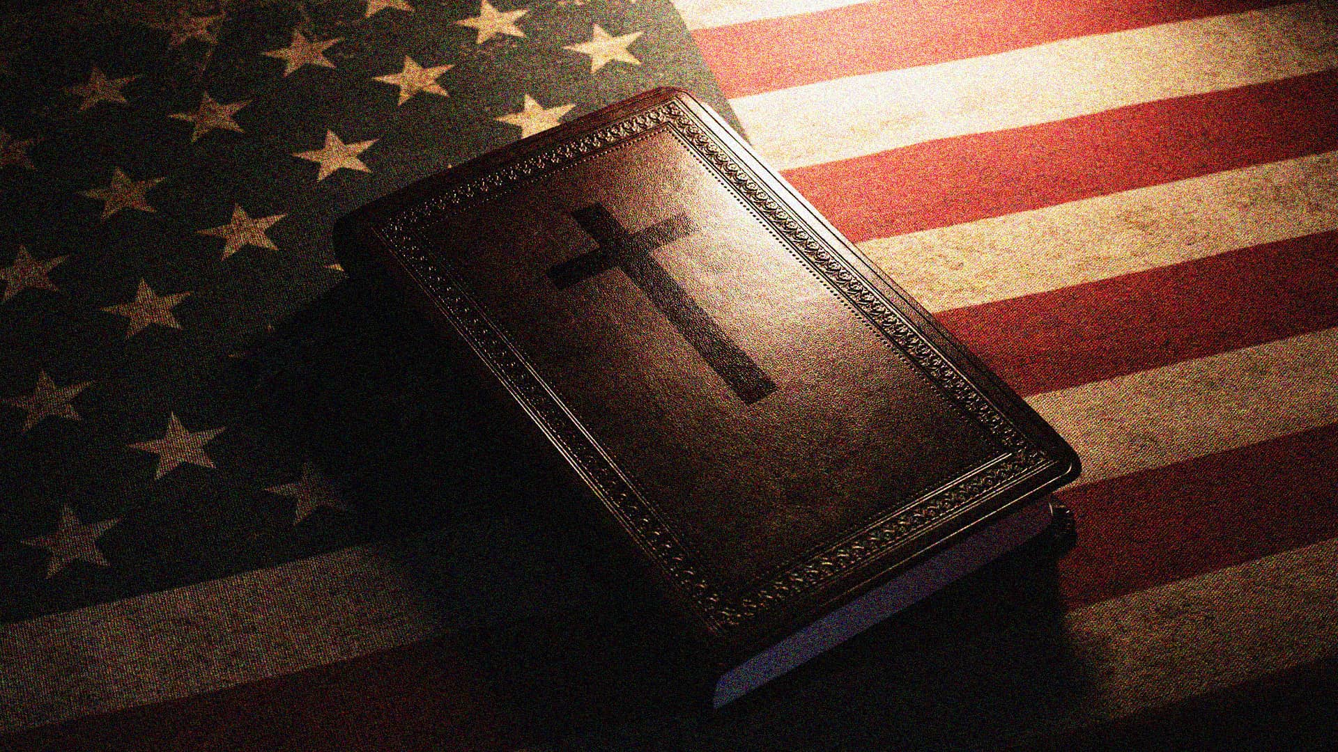 American flag with Bible laying on top